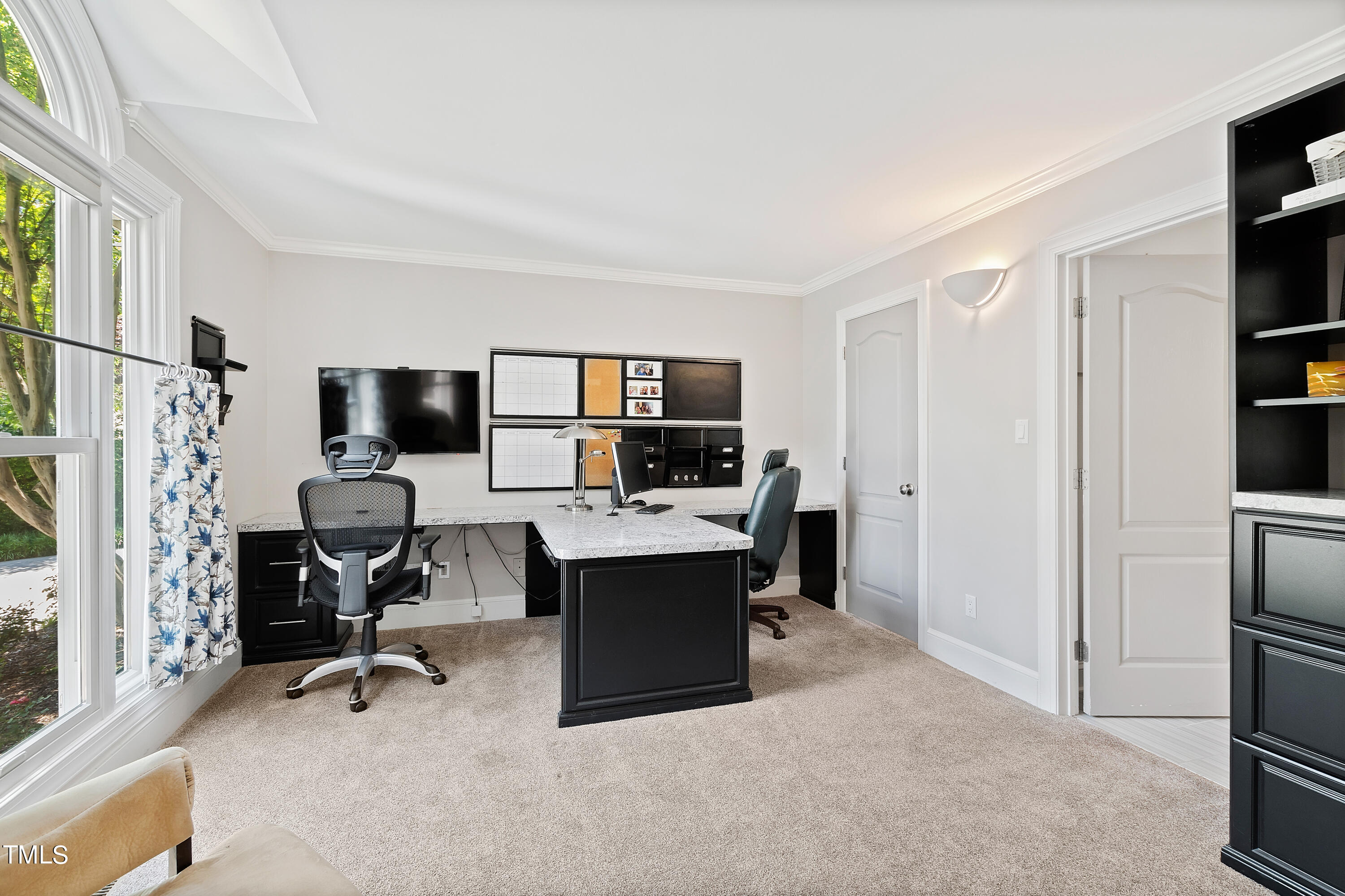 1605 Quaker Ridge Point Raleigh, NC 27615 - Photo 28 of 54 a view of a livingroom with workspace and a window