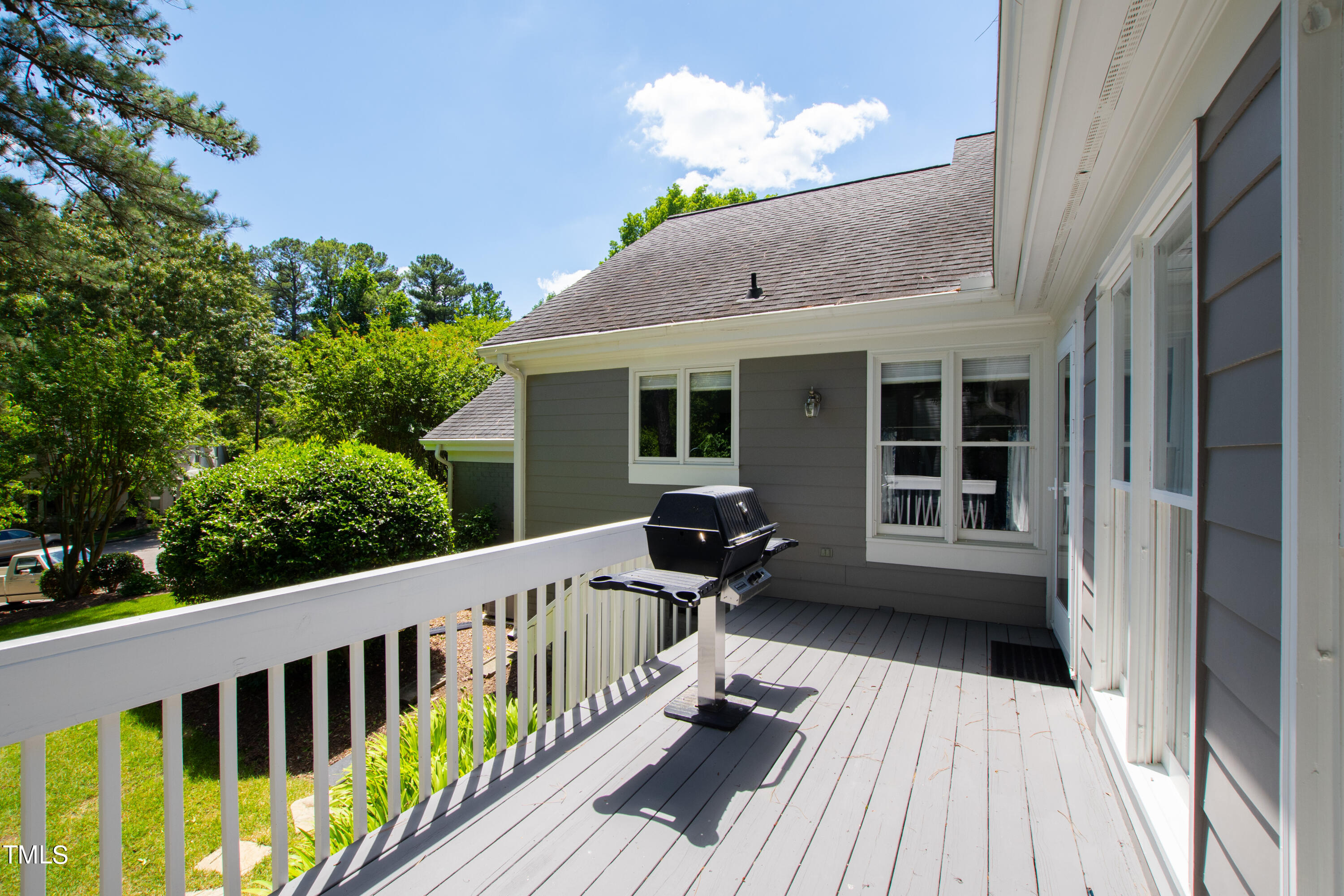 1605 Quaker Ridge Point Raleigh, NC 27615 - Photo 45 of 54 a view of a house with wooden deck