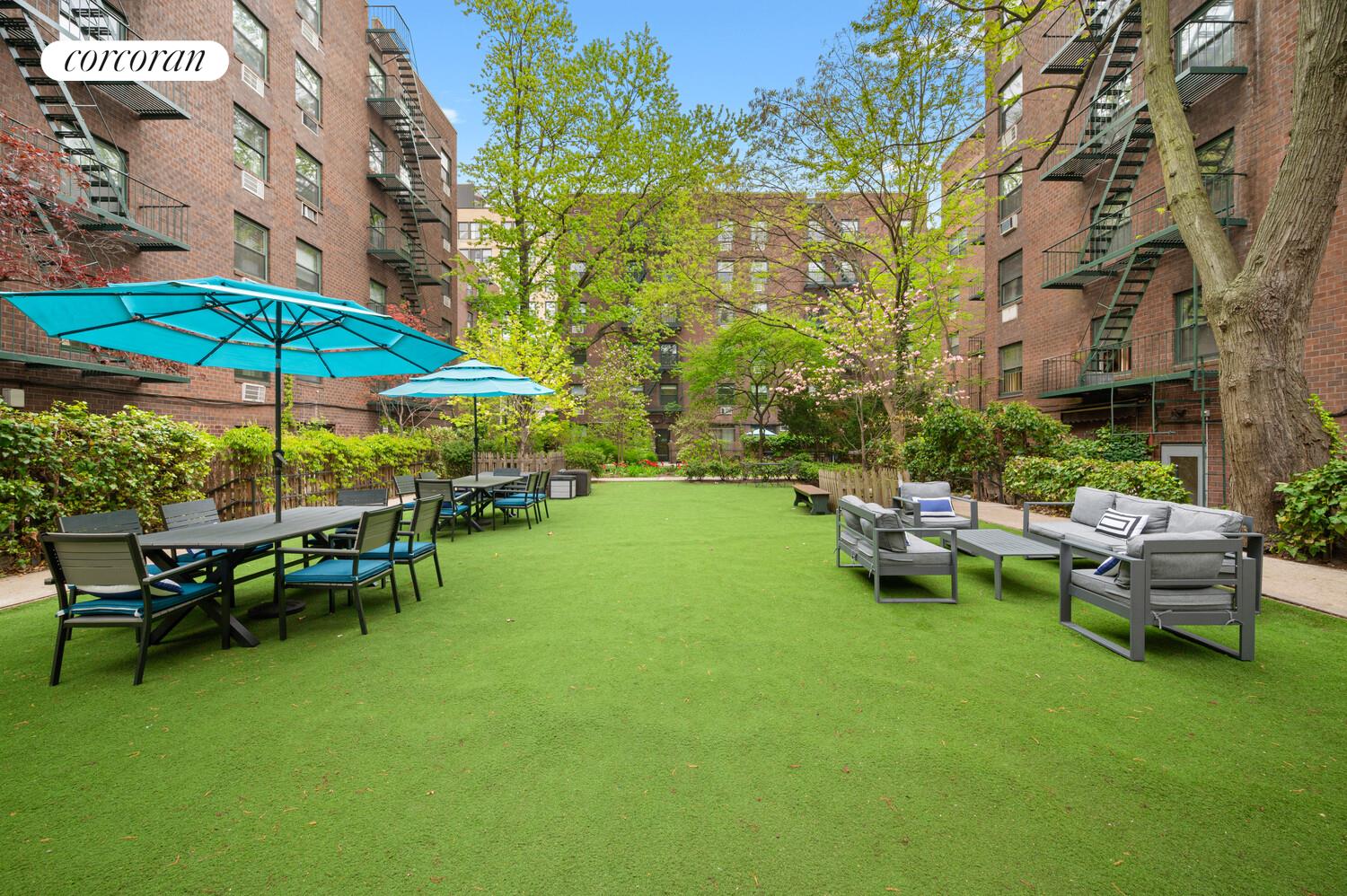 618 Washington Street, Unit GA Manhattan, NY 10014 - Photo 12 of 14 a view of a house with backyard sitting area and garden