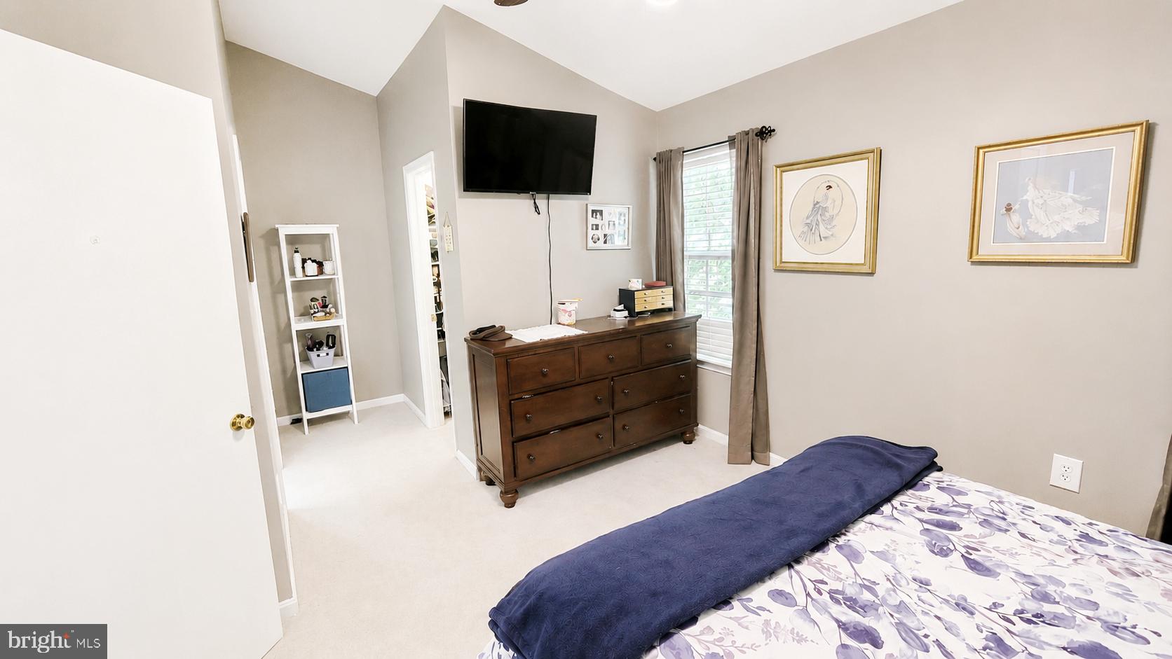 15370 Inlet Place Dumfries, VA 22025 - Photo 13 of 30 a bedroom with a bed and flat screen tv
