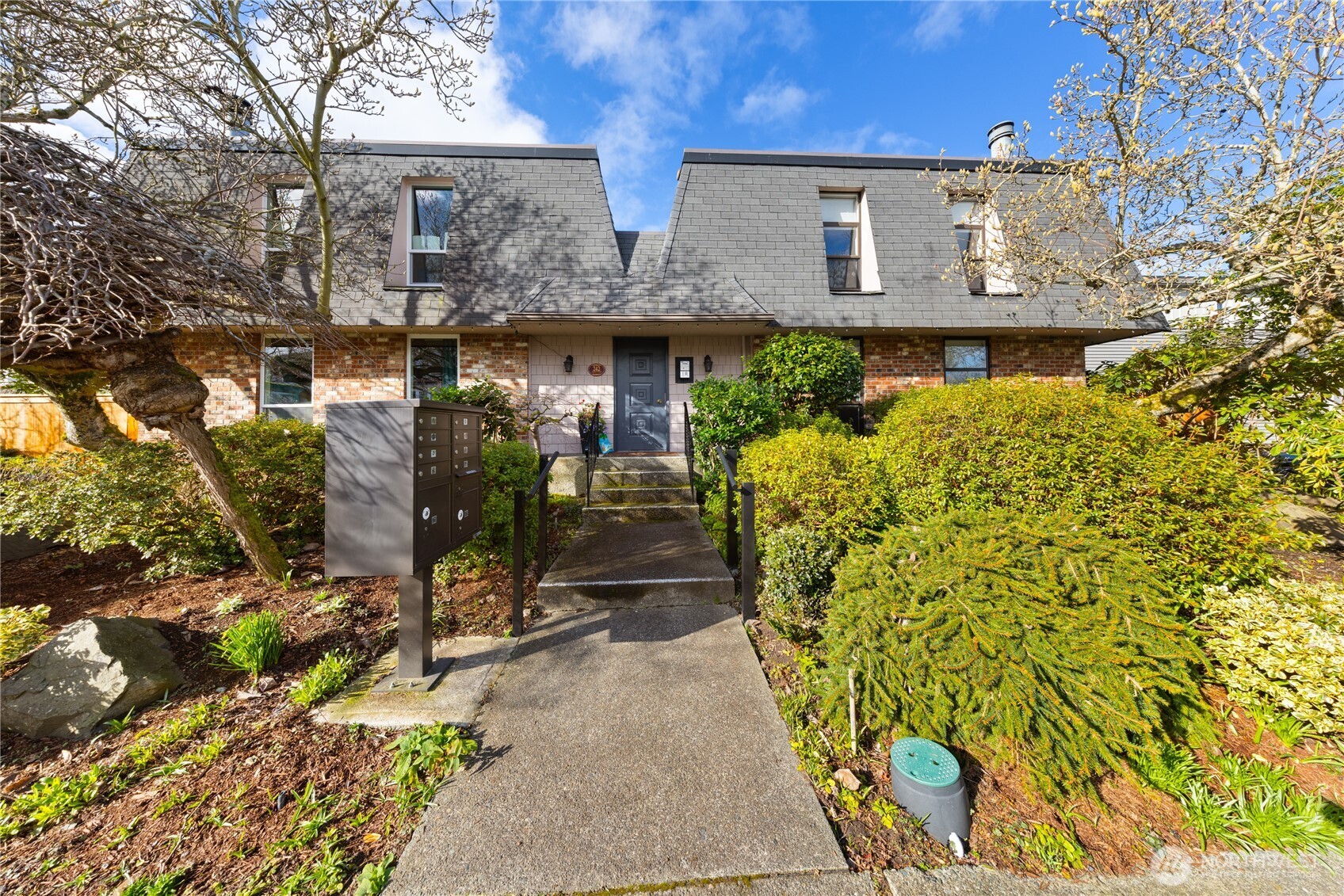 front view of a house with a yard