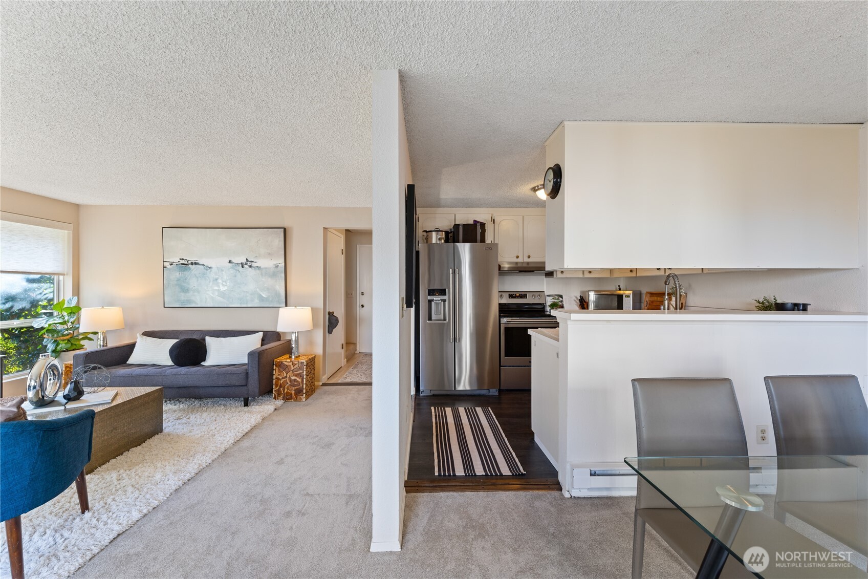 242 4th Avenue South, Unit 2 Edmonds, WA 98020 - Photo 12 of 34 a living room with stainless steel appliances furniture and a kitchen view