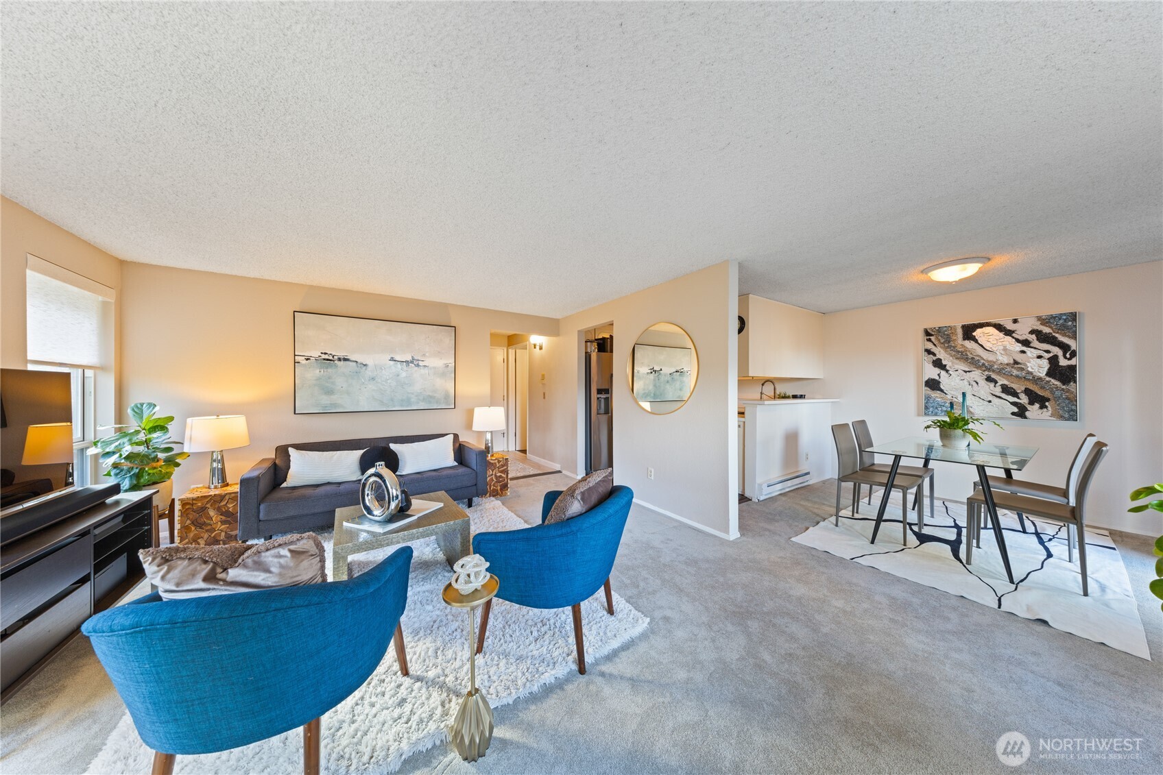 242 4th Avenue South, Unit 2 Edmonds, WA 98020 - Photo 14 of 34 a living room with furniture a flat screen tv and a window
