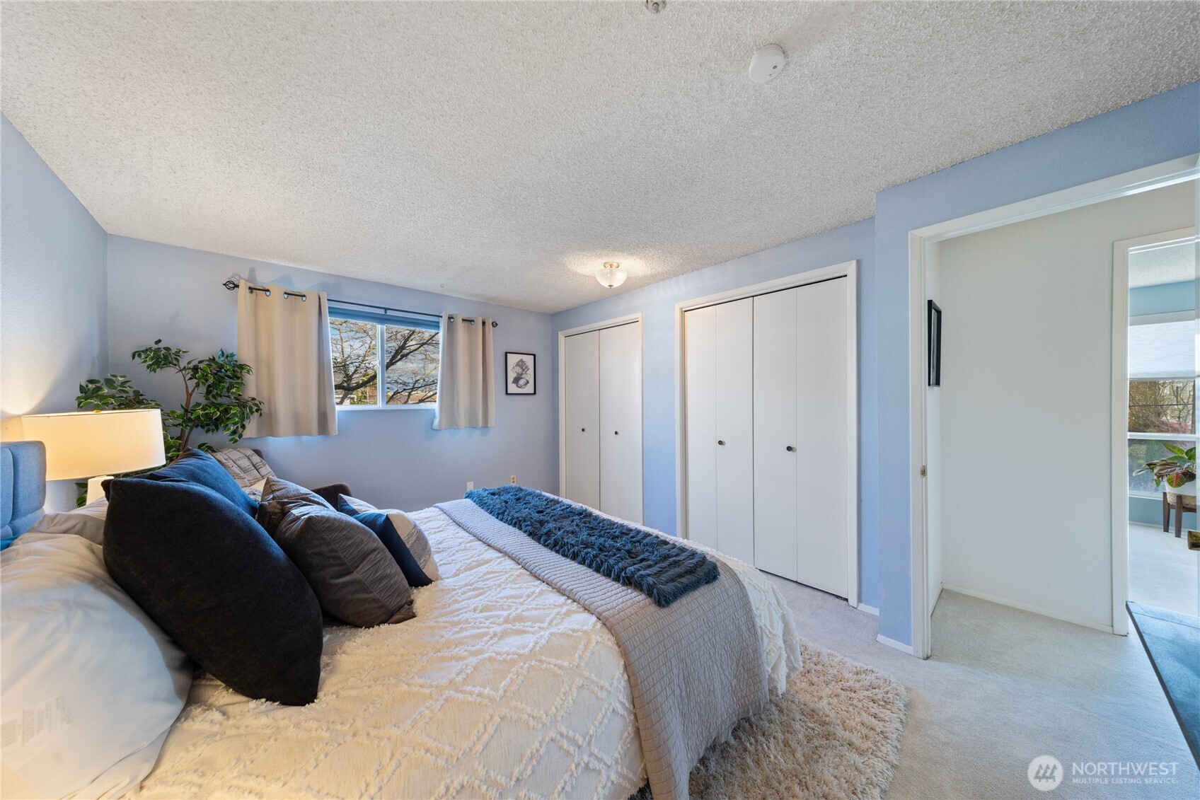 242 4th Avenue South, Unit 2 Edmonds, WA 98020 - Photo 16 of 34 a bedroom with a bed and a window