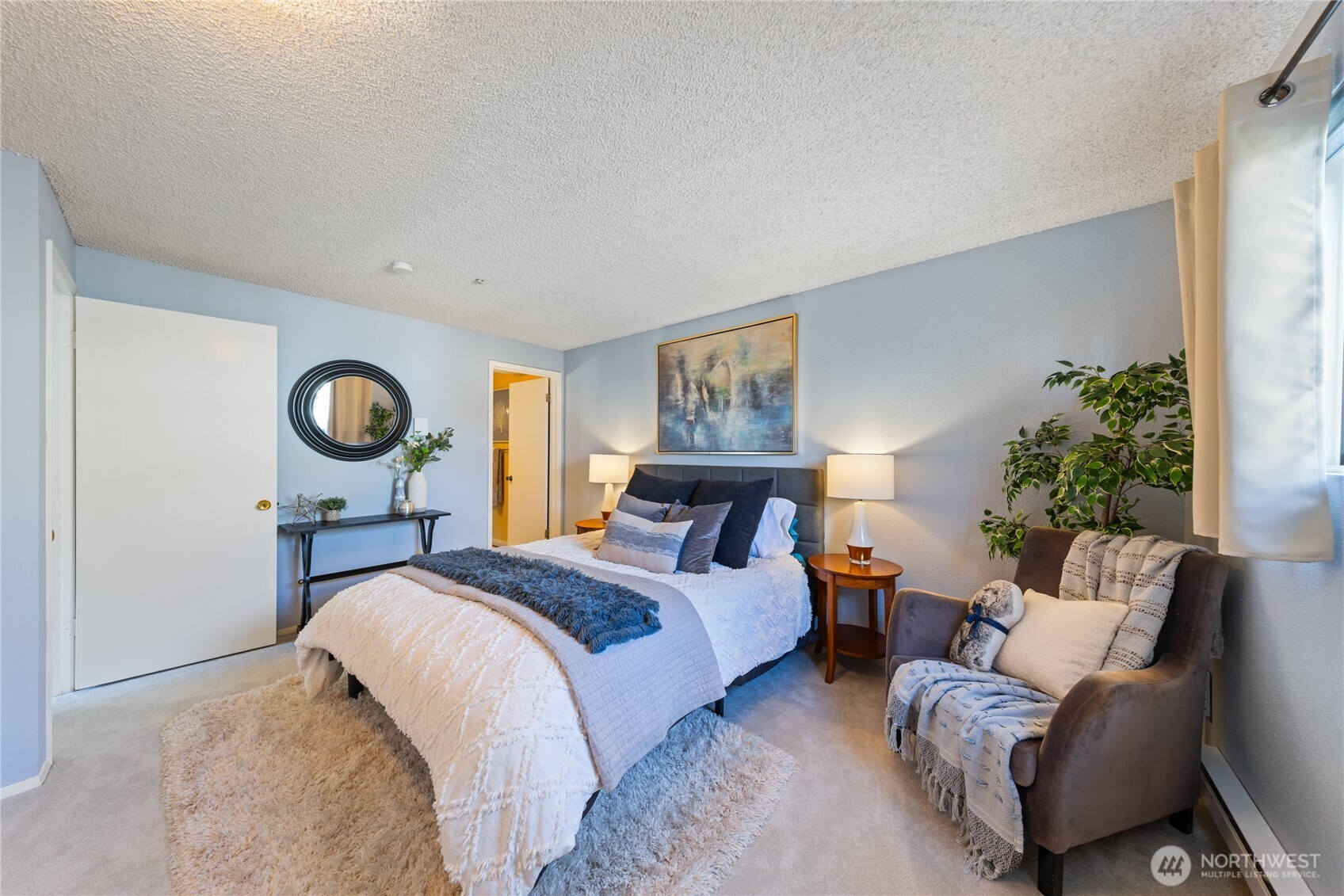 242 4th Avenue South, Unit 2 Edmonds, WA 98020 - Photo 17 of 34 a bed room with a bed furniture and a window