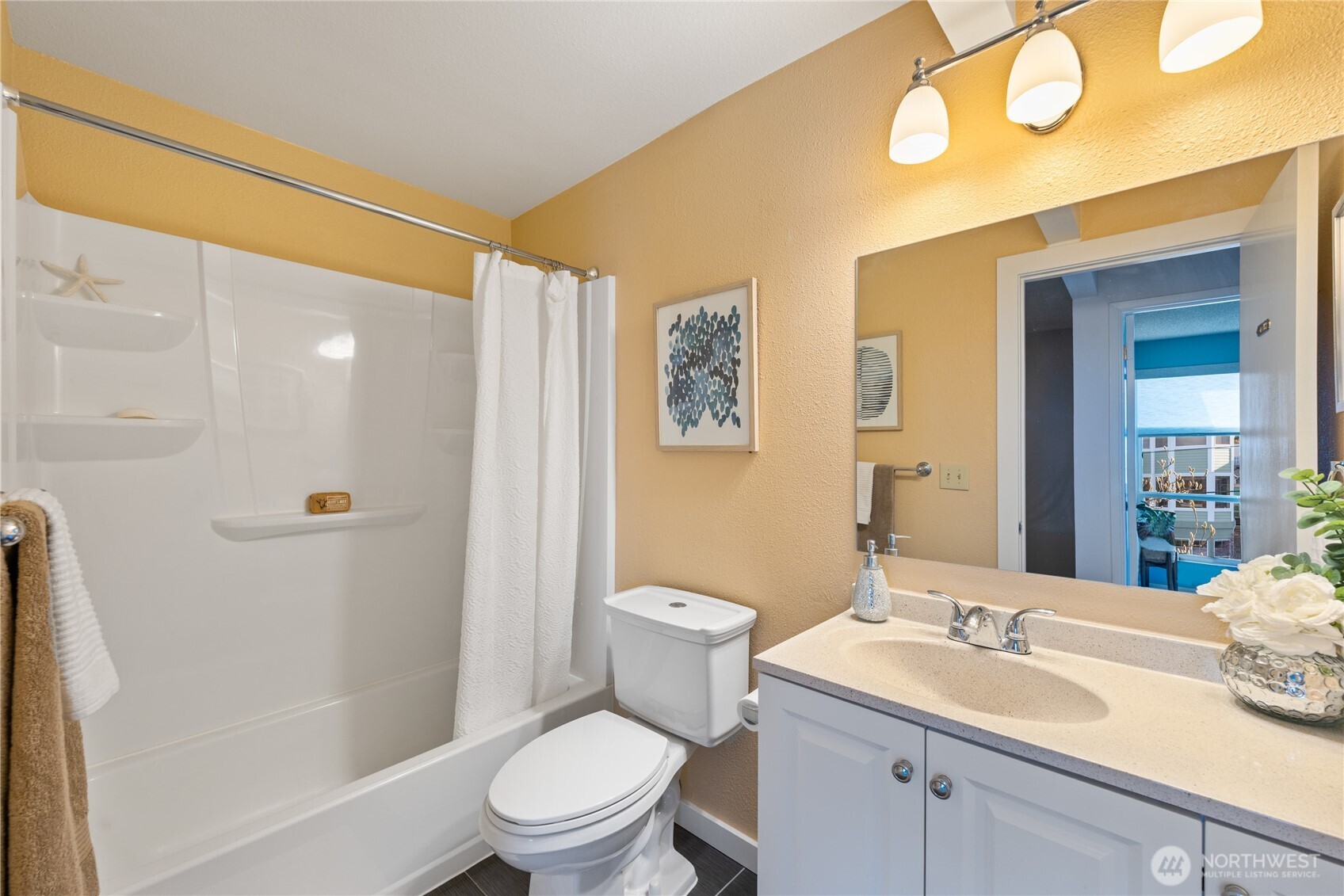 242 4th Avenue South, Unit 2 Edmonds, WA 98020 - Photo 18 of 34 a bathroom with a sink a toilet and shower