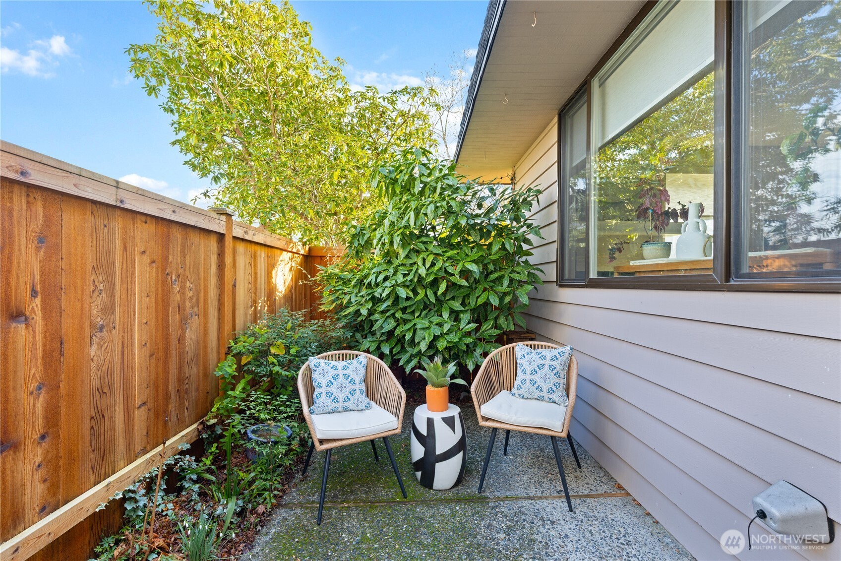 242 4th Avenue South, Unit 2 Edmonds, WA 98020 - Photo 23 of 34 a view of a chair and table in backyard of the house