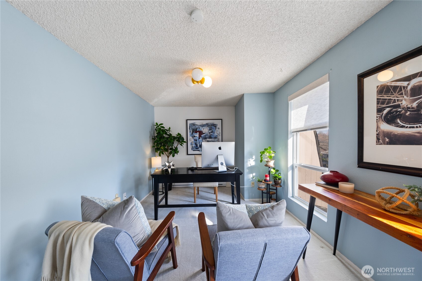 242 4th Avenue South, Unit 2 Edmonds, WA 98020 - Photo 26 of 34 a living room with furniture and a flat screen tv