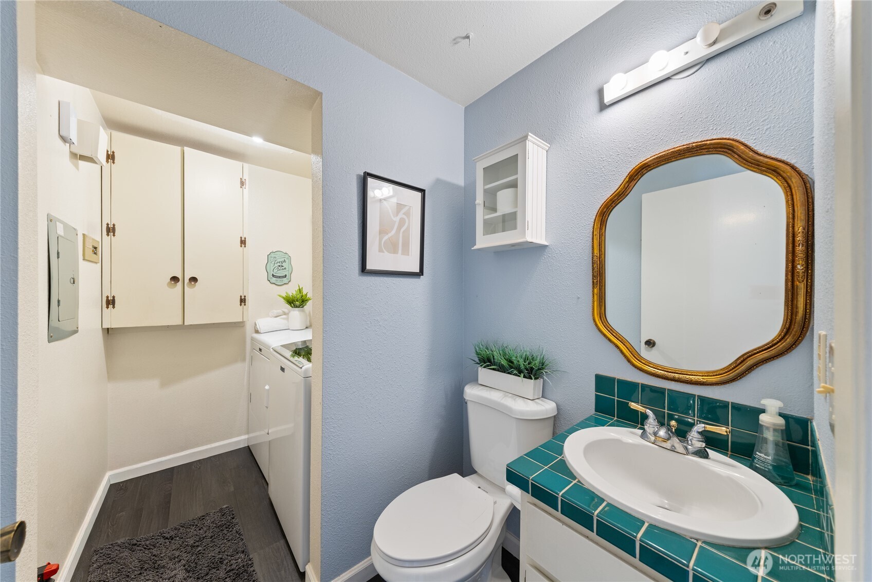 242 4th Avenue South, Unit 2 Edmonds, WA 98020 - Photo 30 of 34 a bathroom with a sink mirror and toilet