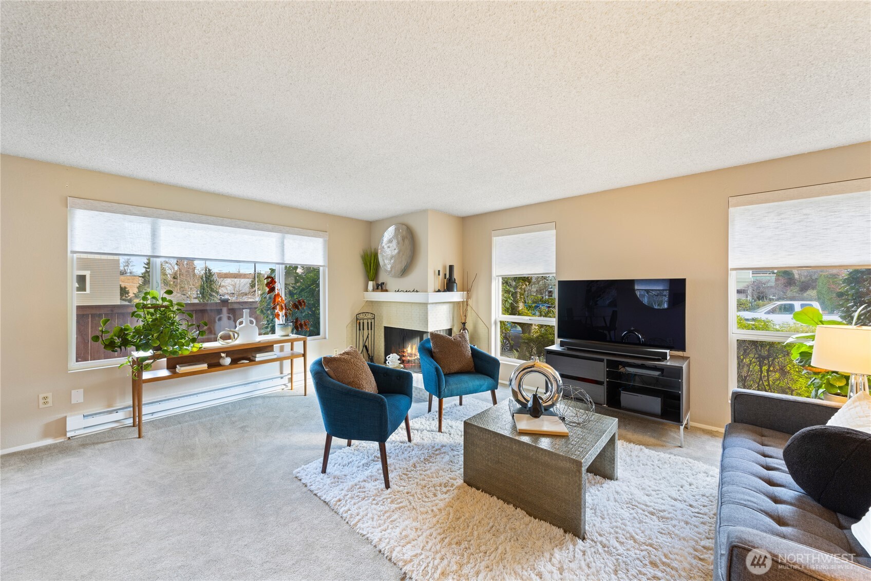 242 4th Avenue South, Unit 2 Edmonds, WA 98020 - Photo 3 of 34 a living room with furniture and a flat screen tv