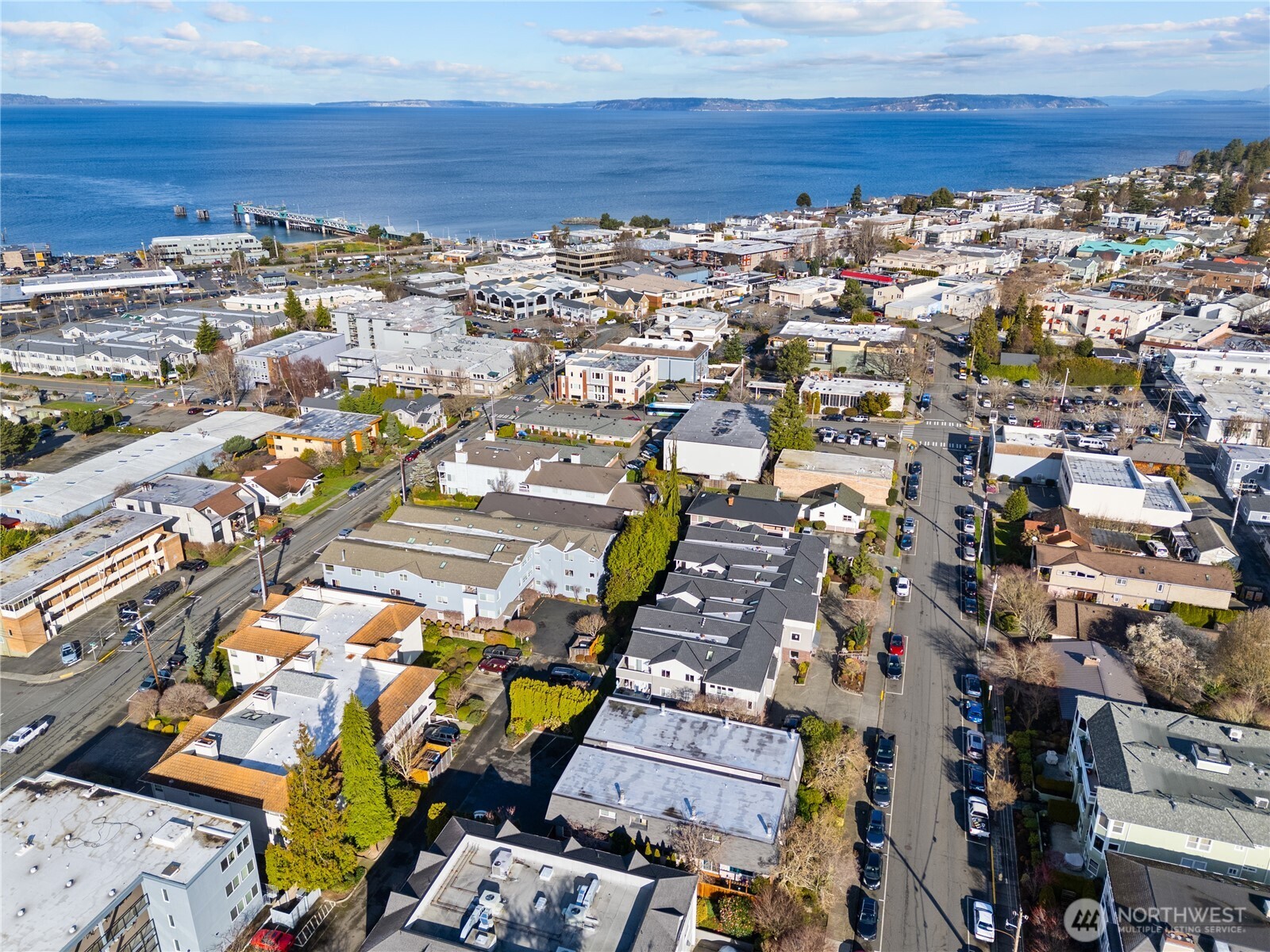 242 4th Avenue South, Unit 2 Edmonds, WA 98020 - Photo 32 of 34 an aerial view of a city with lots of residential buildings and parking space