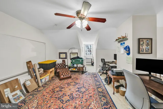 a view of a dining room with furniture and a window
