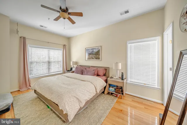 a bathroom with a glass door shower and a sink