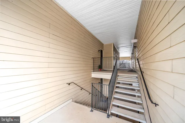 a view of a building with a snow on the road
