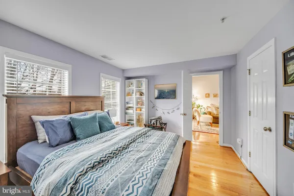 a bed room with furniture and wooden floor