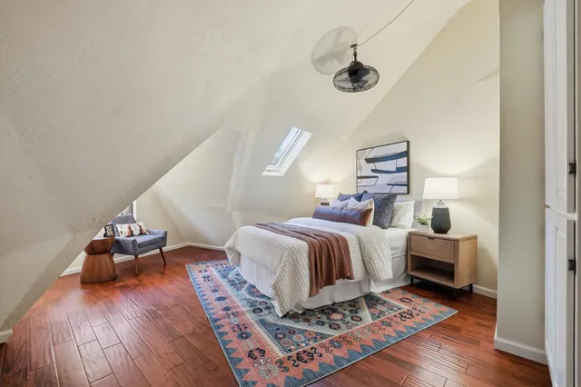 a view of room with wooden floor and window