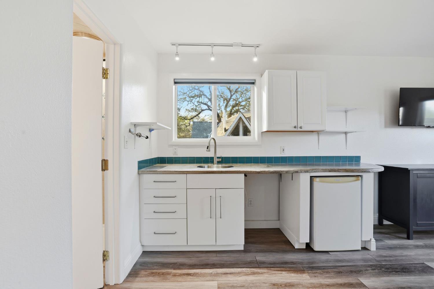 7890 Boren Lane Granite Bay, CA 95746 - Photo 63 of 96 a view of cabinets a sink and a window in a room
