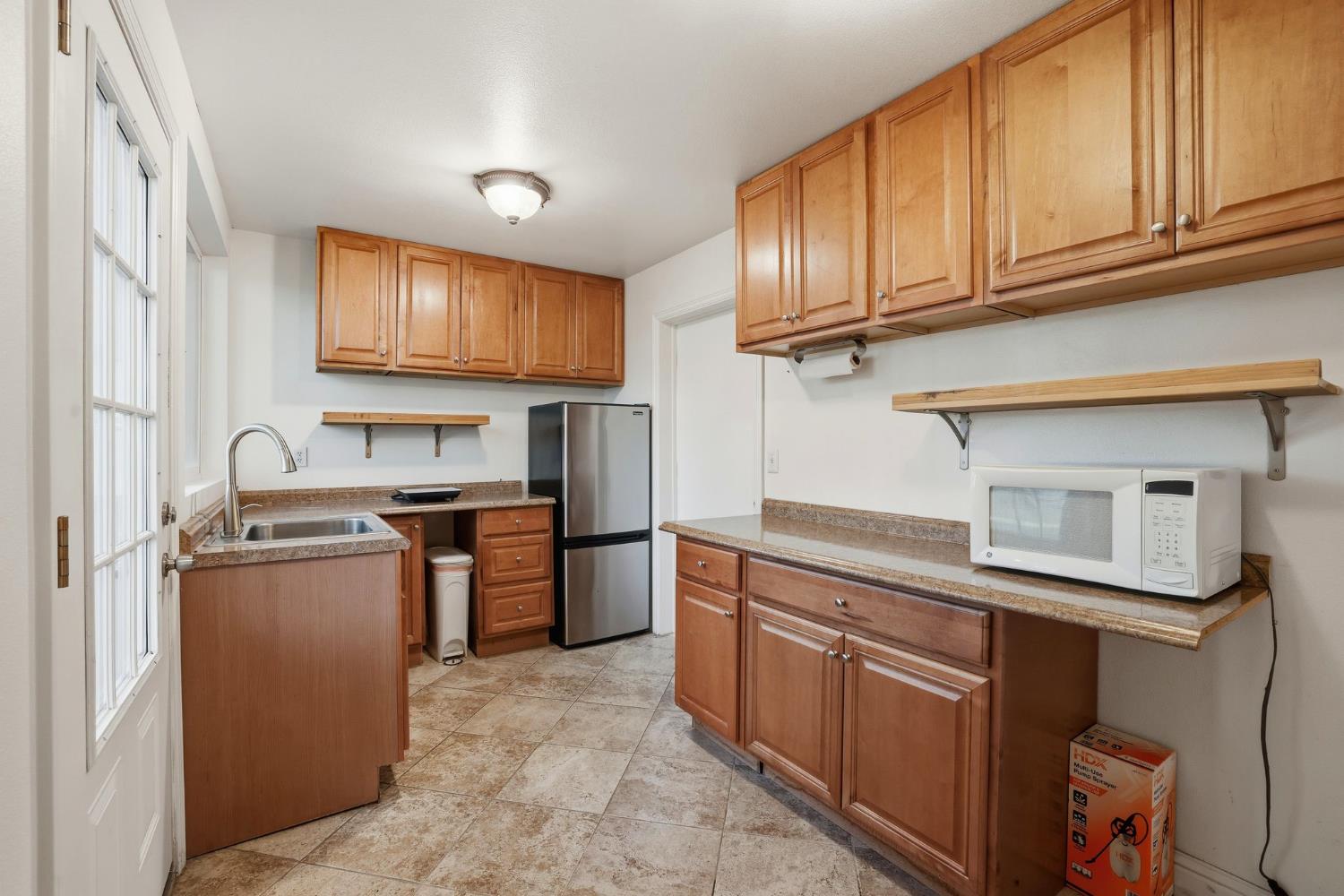 7890 Boren Lane Granite Bay, CA 95746 - Photo 81 of 96 a kitchen with stainless steel appliances granite countertop a sink stove and cabinets