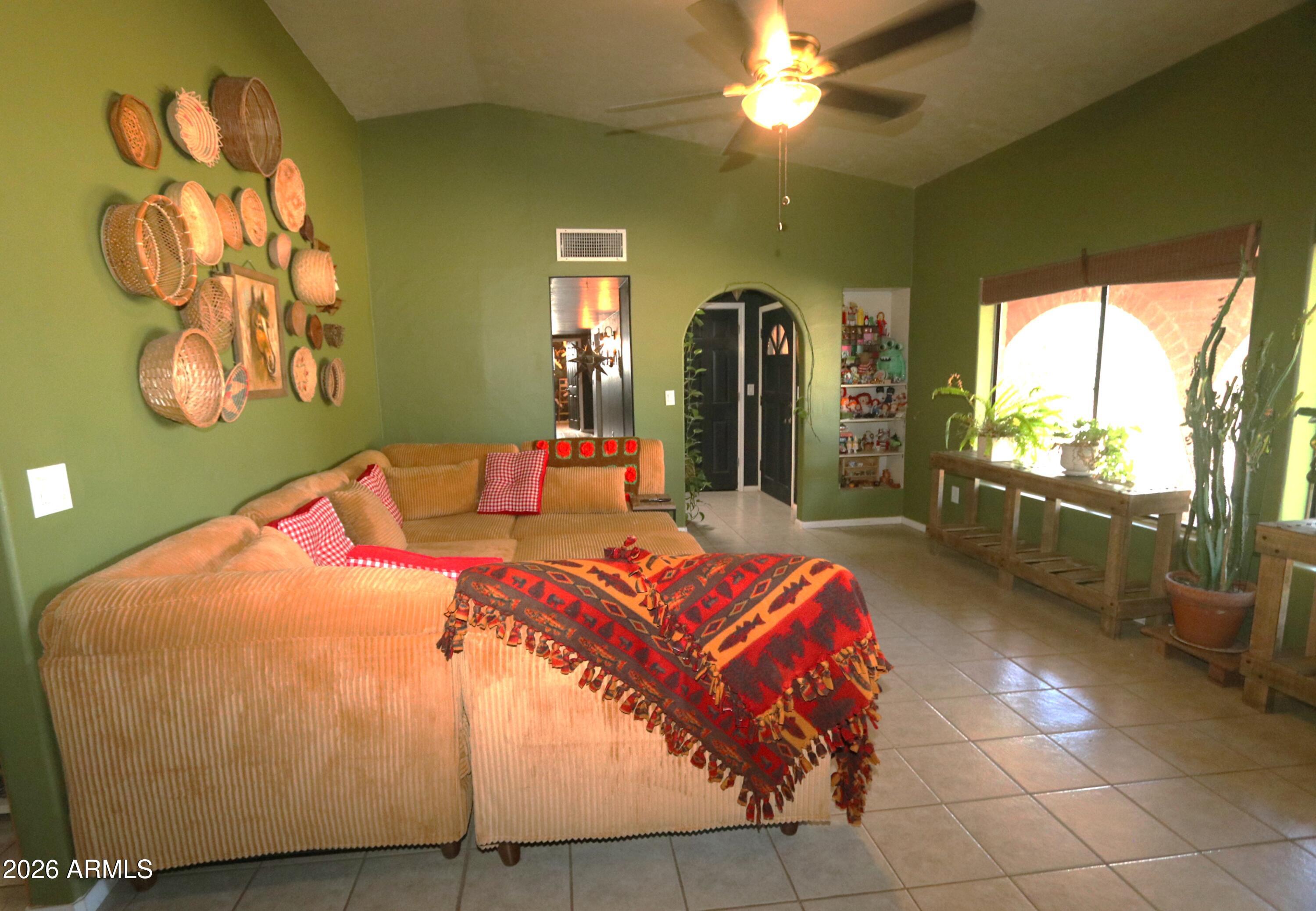 11870 Fort Grant Road Willcox, AZ 85643 - Photo 11 of 44 a bedroom with a bed and window