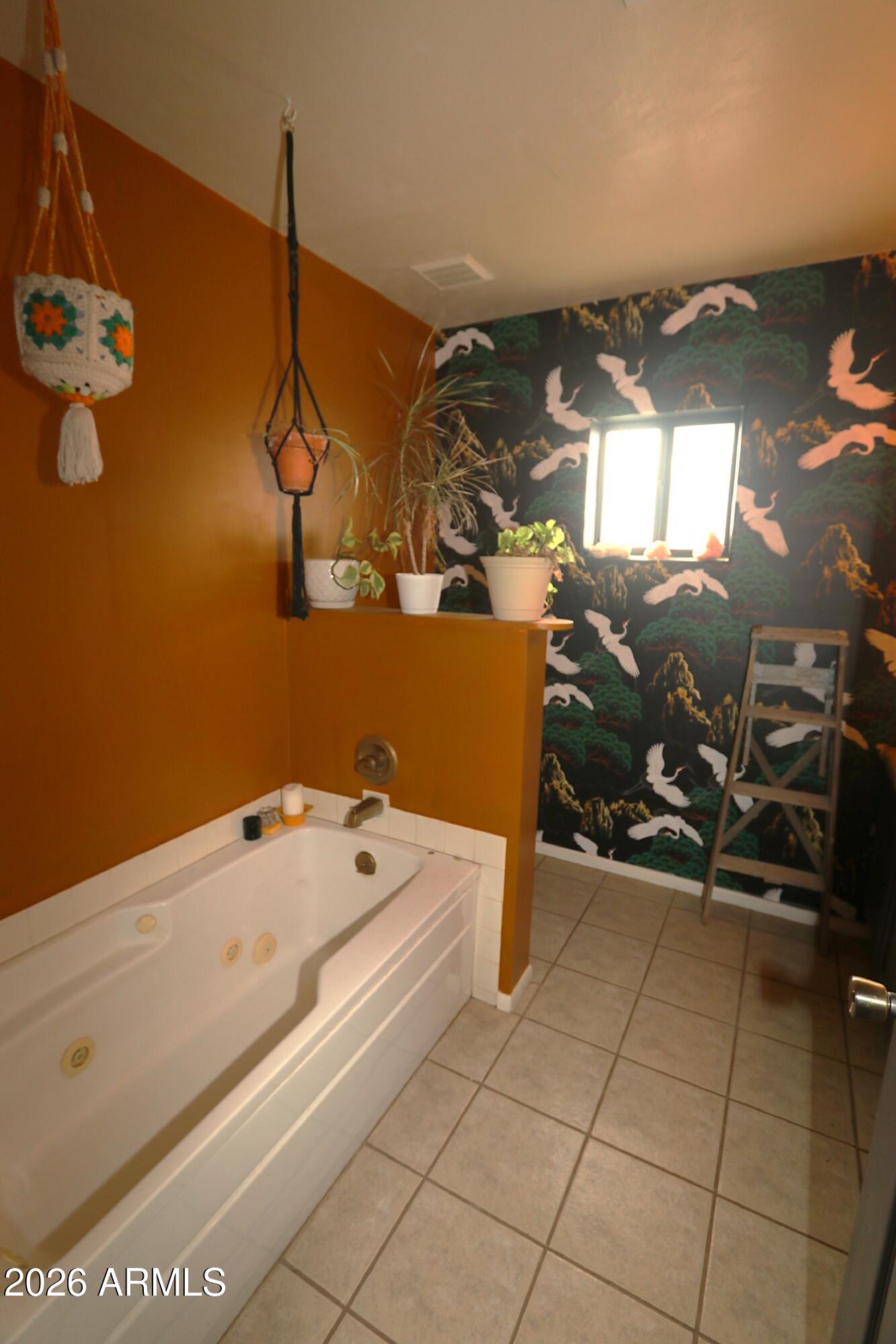 11870 Fort Grant Road Willcox, AZ 85643 - Photo 14 of 44 a bathroom with a tub and a window