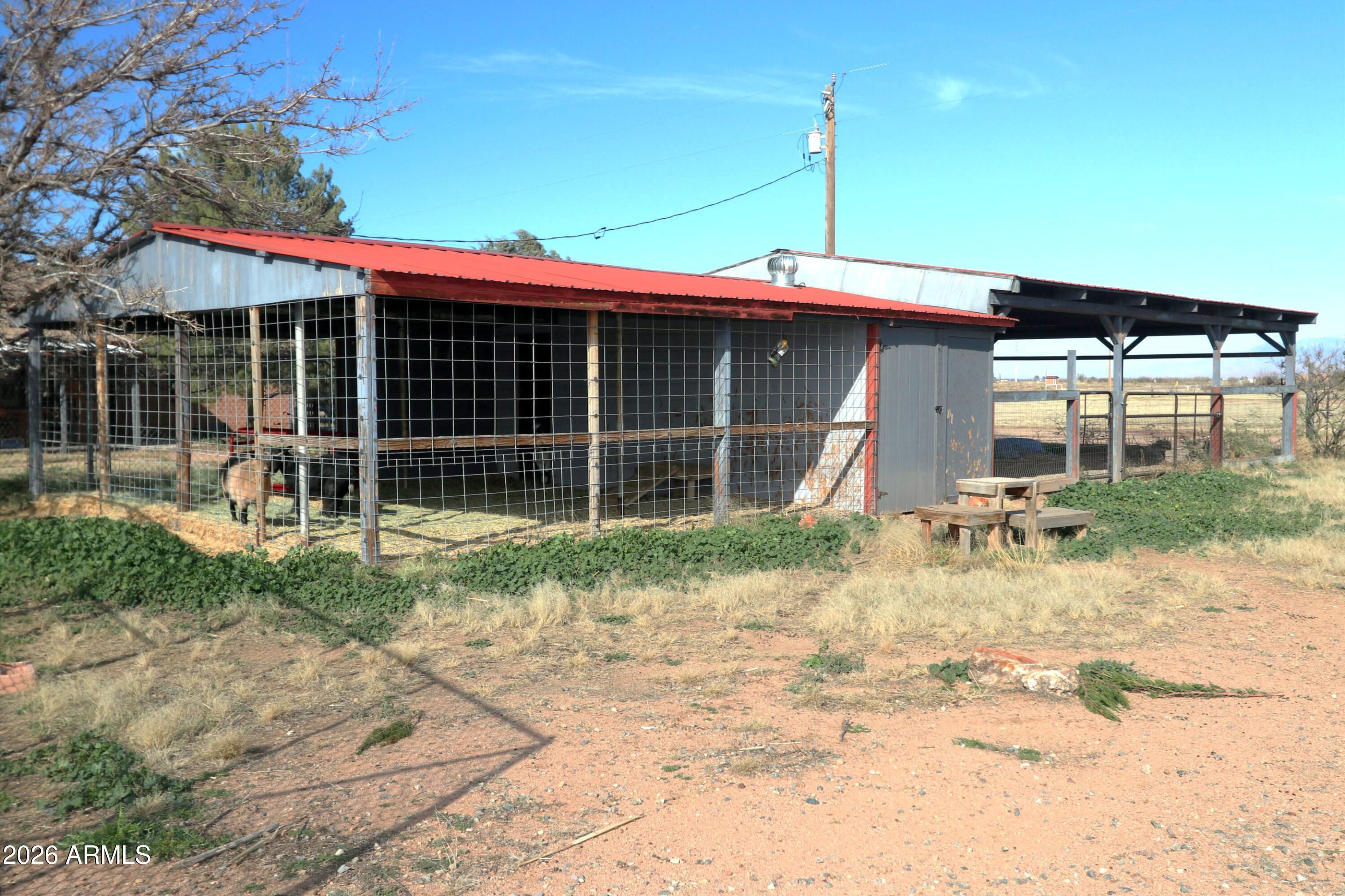11870 Fort Grant Road Willcox, AZ 85643 - Photo 28 of 44 a backyard of a house with plants and outdoor seating