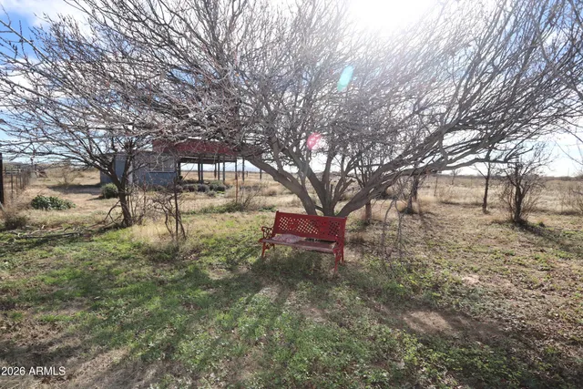 a view of a large mountain with mountains in the background