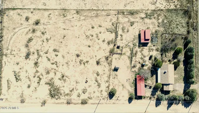 a view of a wooden deck and a backyard