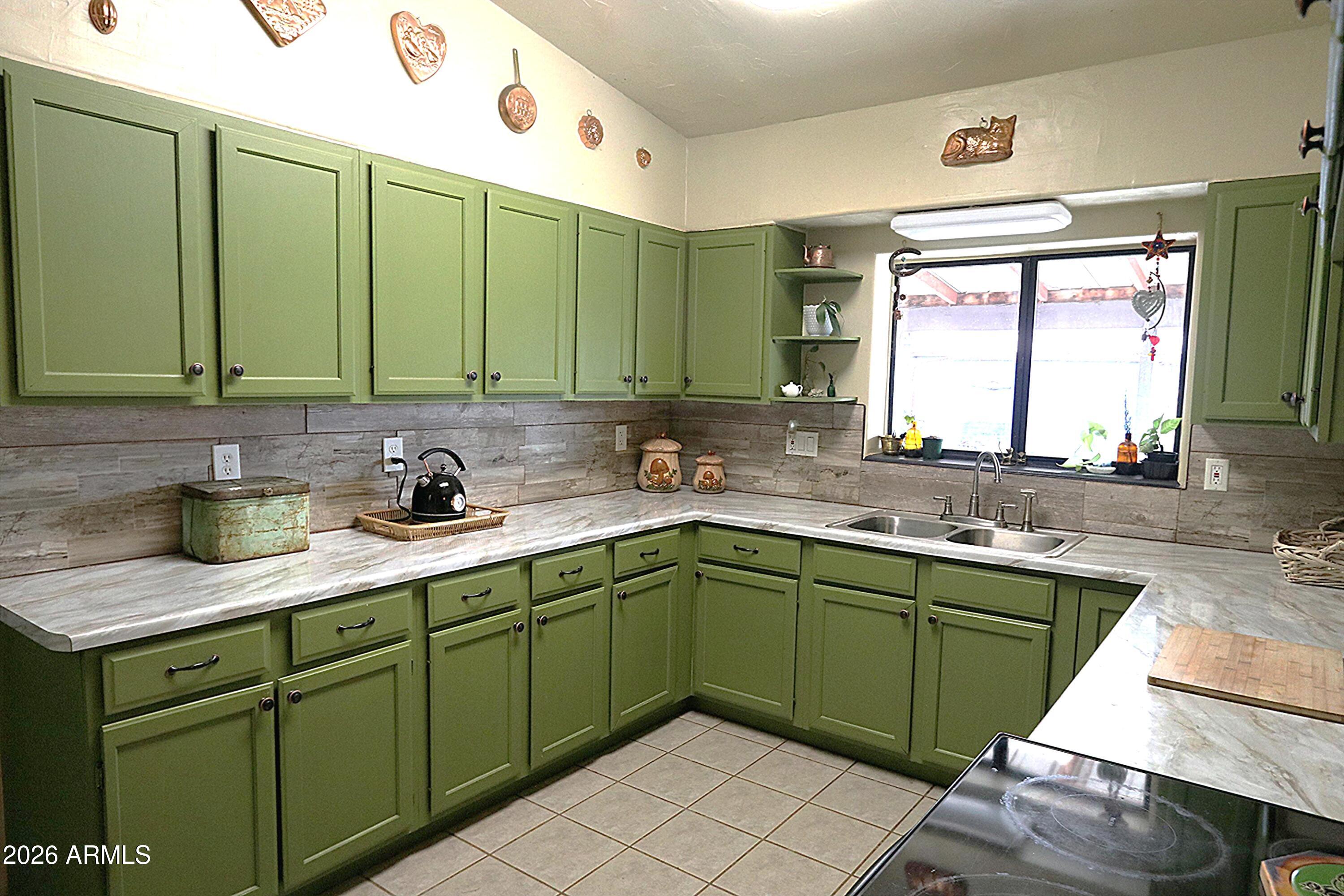 11870 Fort Grant Road Willcox, AZ 85643 - Photo 4 of 44 a kitchen with a sink and cabinets