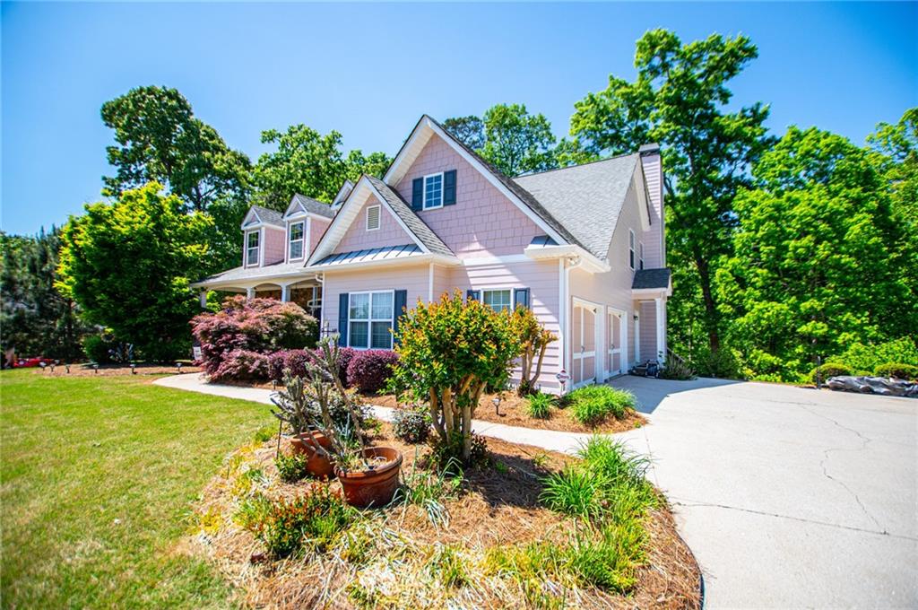 6170 Hedgestone Way Douglasville, GA 30135 - Photo 106 of 106 a front view of a house with garden