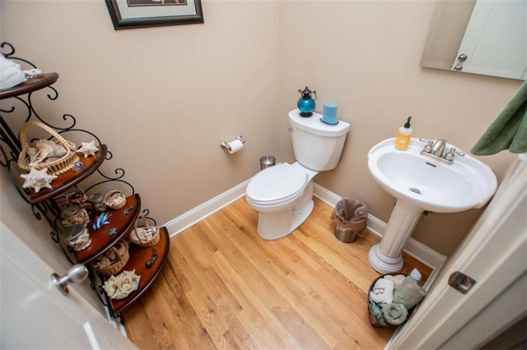 6170 Hedgestone Way Douglasville, GA 30135 - Photo 12 of 106 a bathroom with a toilet sink and mirror