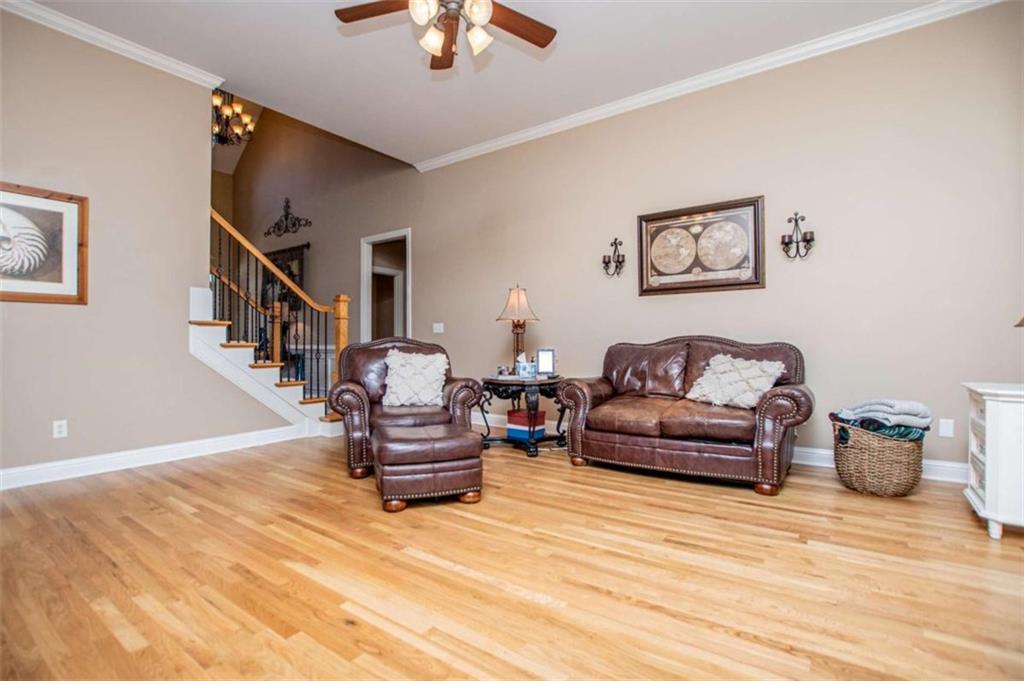 6170 Hedgestone Way Douglasville, GA 30135 - Photo 14 of 106 a living room with furniture and a wooden floor