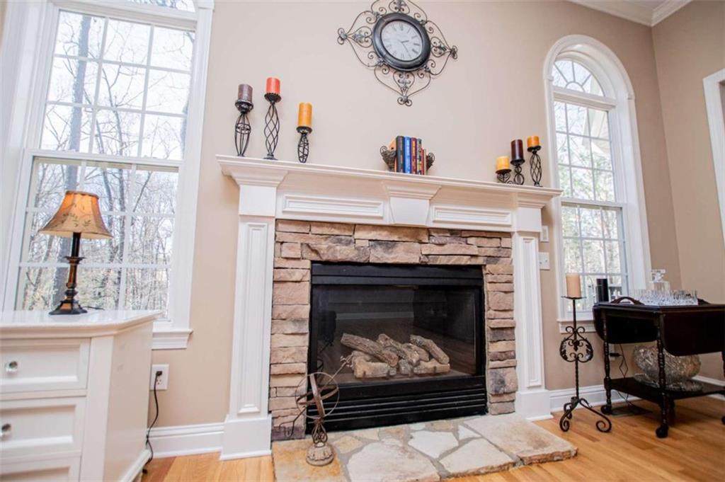 6170 Hedgestone Way Douglasville, GA 30135 - Photo 27 of 106 a living room with furniture and a fireplace