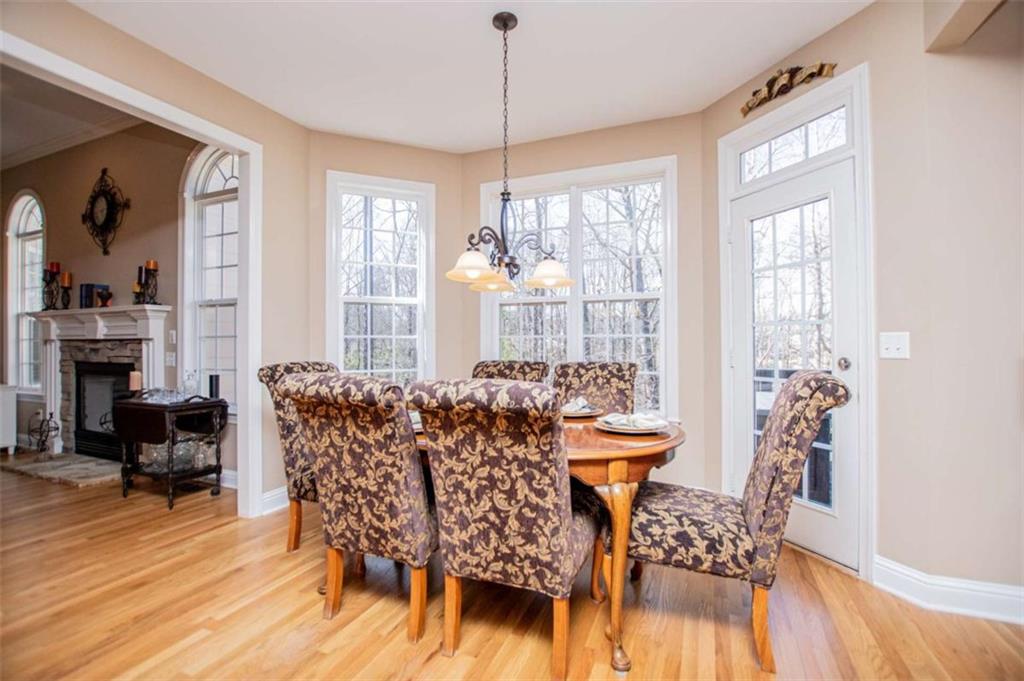6170 Hedgestone Way Douglasville, GA 30135 - Photo 28 of 106 a view of a dining room with furniture window and wooden floor