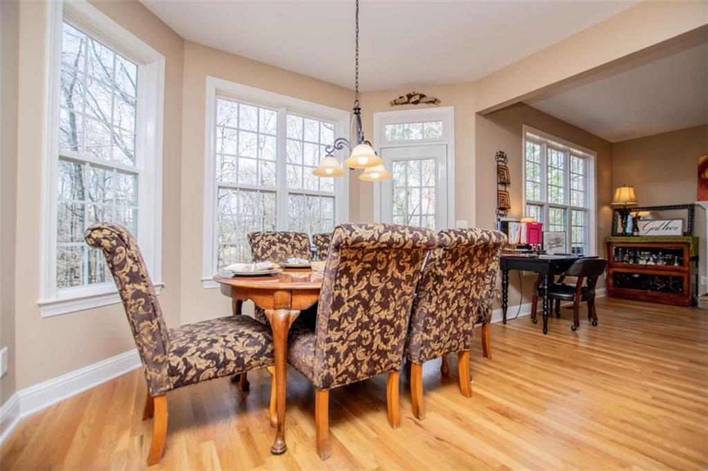6170 Hedgestone Way Douglasville, GA 30135 - Photo 31 of 106 a view of a dining room with furniture and wooden floor