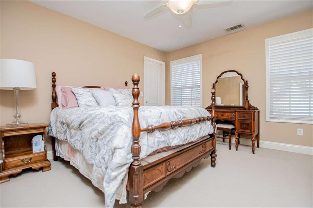 6170 Hedgestone Way Douglasville, GA 30135 - Photo 45 of 106 a bed room with a bed and a chair