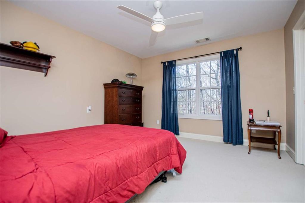 6170 Hedgestone Way Douglasville, GA 30135 - Photo 54 of 106 a bedroom with a bed and a window