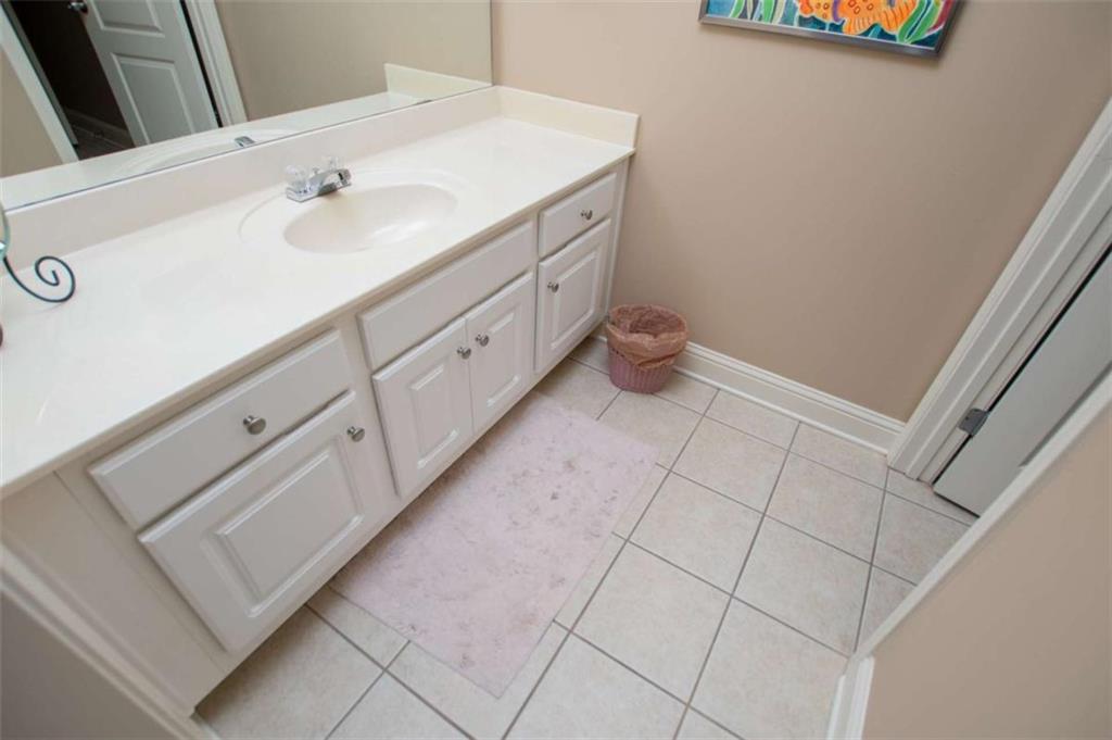 6170 Hedgestone Way Douglasville, GA 30135 - Photo 61 of 106 a bathroom with a sink and a mirror