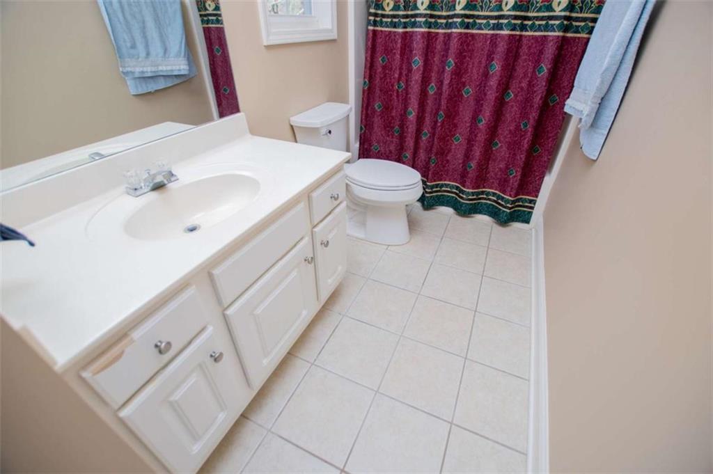 6170 Hedgestone Way Douglasville, GA 30135 - Photo 65 of 106 a bathroom with a sink a toilet and shower