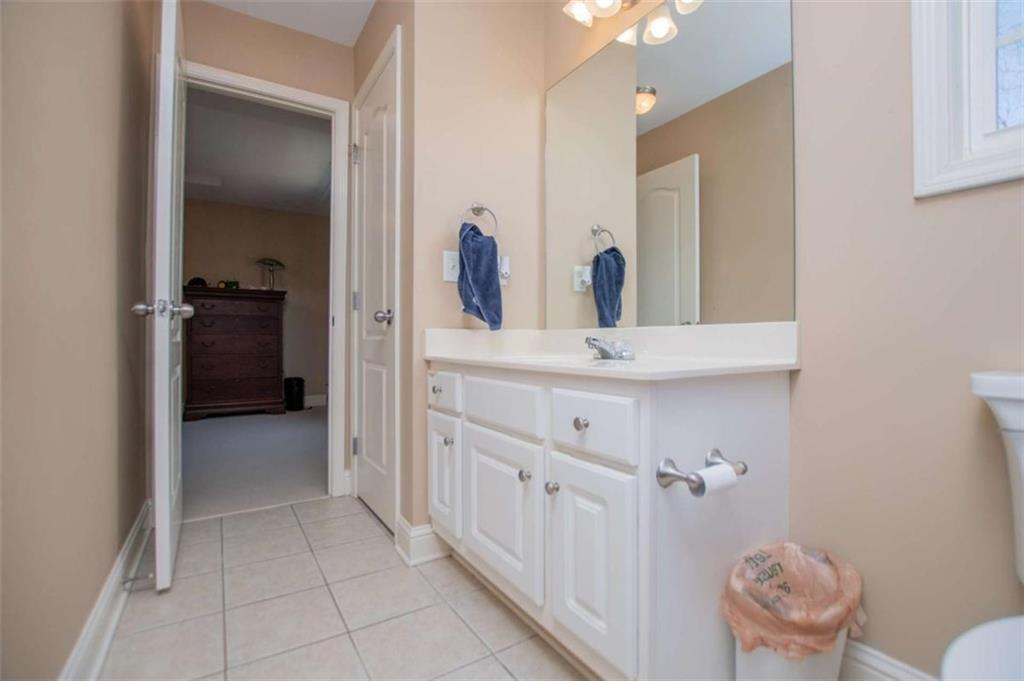 6170 Hedgestone Way Douglasville, GA 30135 - Photo 66 of 106 a bathroom with a sink and a mirror