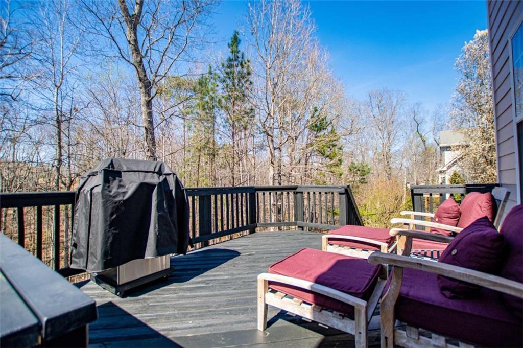 6170 Hedgestone Way Douglasville, GA 30135 - Photo 75 of 106 a balcony with wooden floor table and chairs