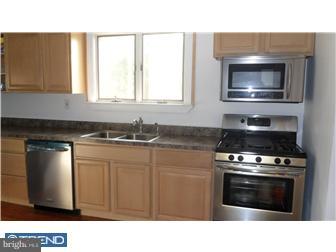 214 Church Road Rockledge, PA 19046 - Photo 4 of 10 a kitchen with a stove and a microwave