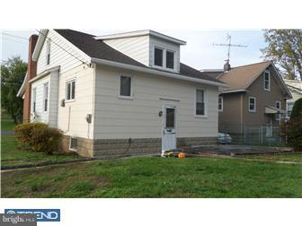 214 Church Road Rockledge, PA 19046 - Photo 10 of 10 a black and white house with a yard