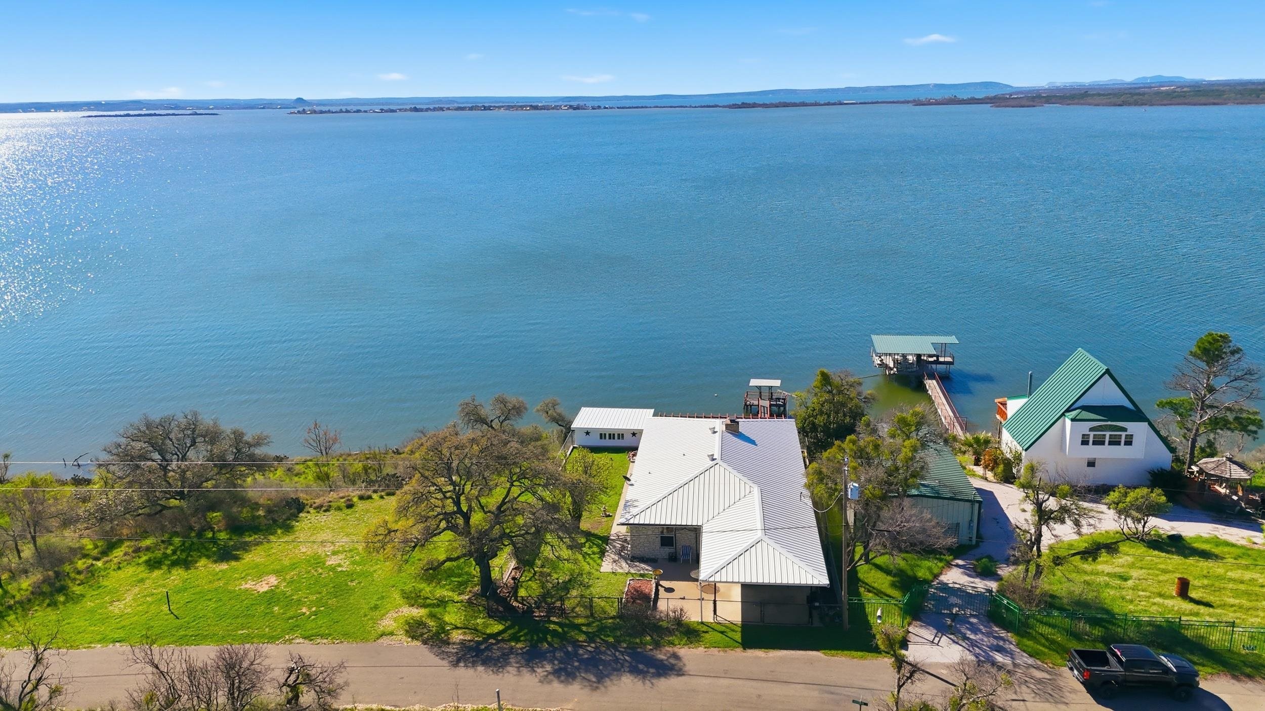919 Lakeshore Loop Tow, TX 78672 - Photo 23 of 33 an aerial view of a house with a lake view