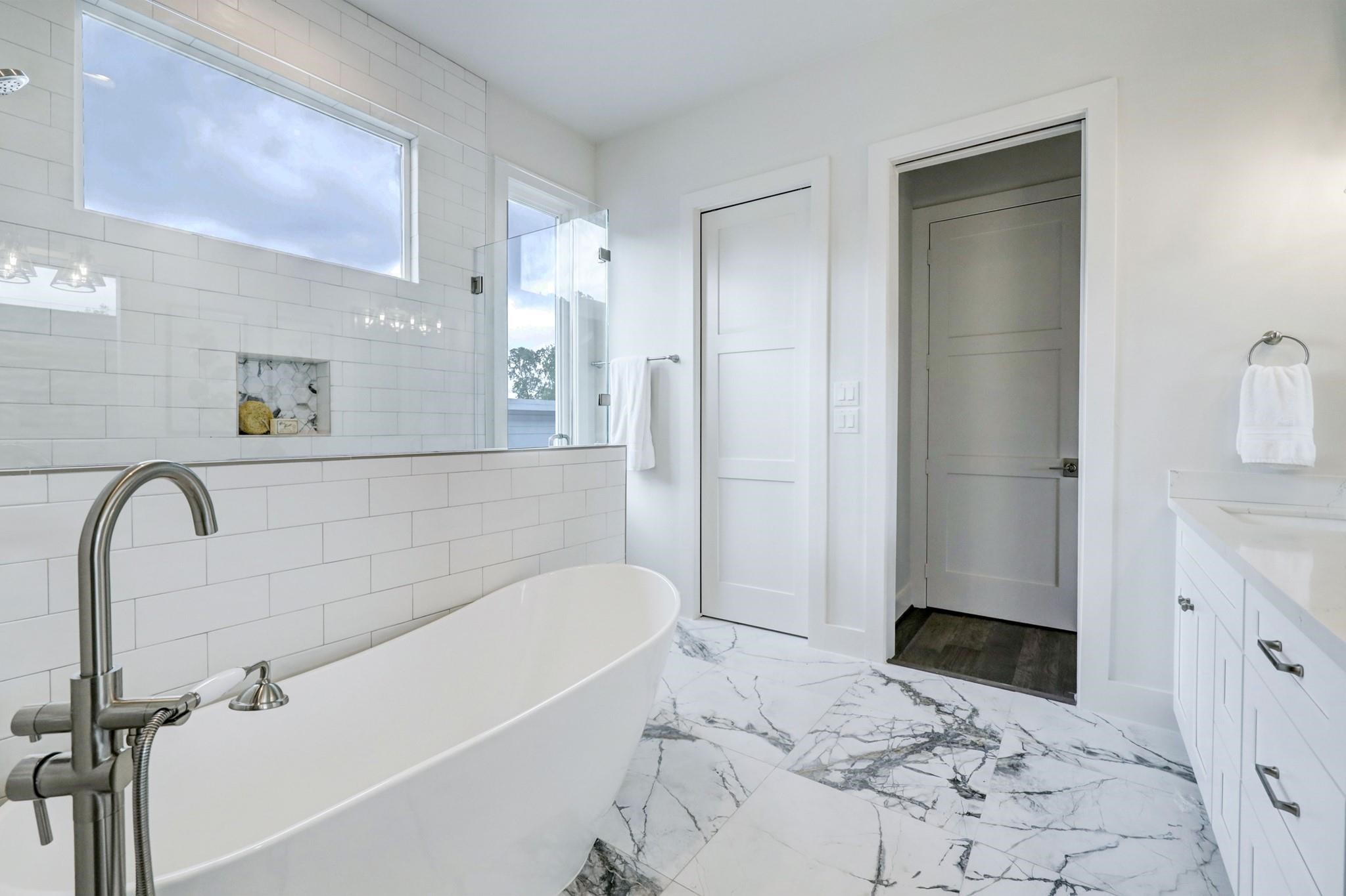 3827 Arlington Street Houston, TX 77018 - Photo 23 of 39 The space is bright, with large windows and white subway tiles that enhance the clean, spacious feel.