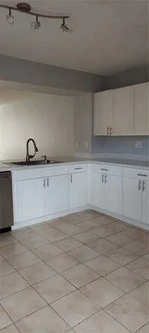 a view of a kitchen with cabinets