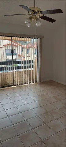 a view of a room with wooden floor and windows