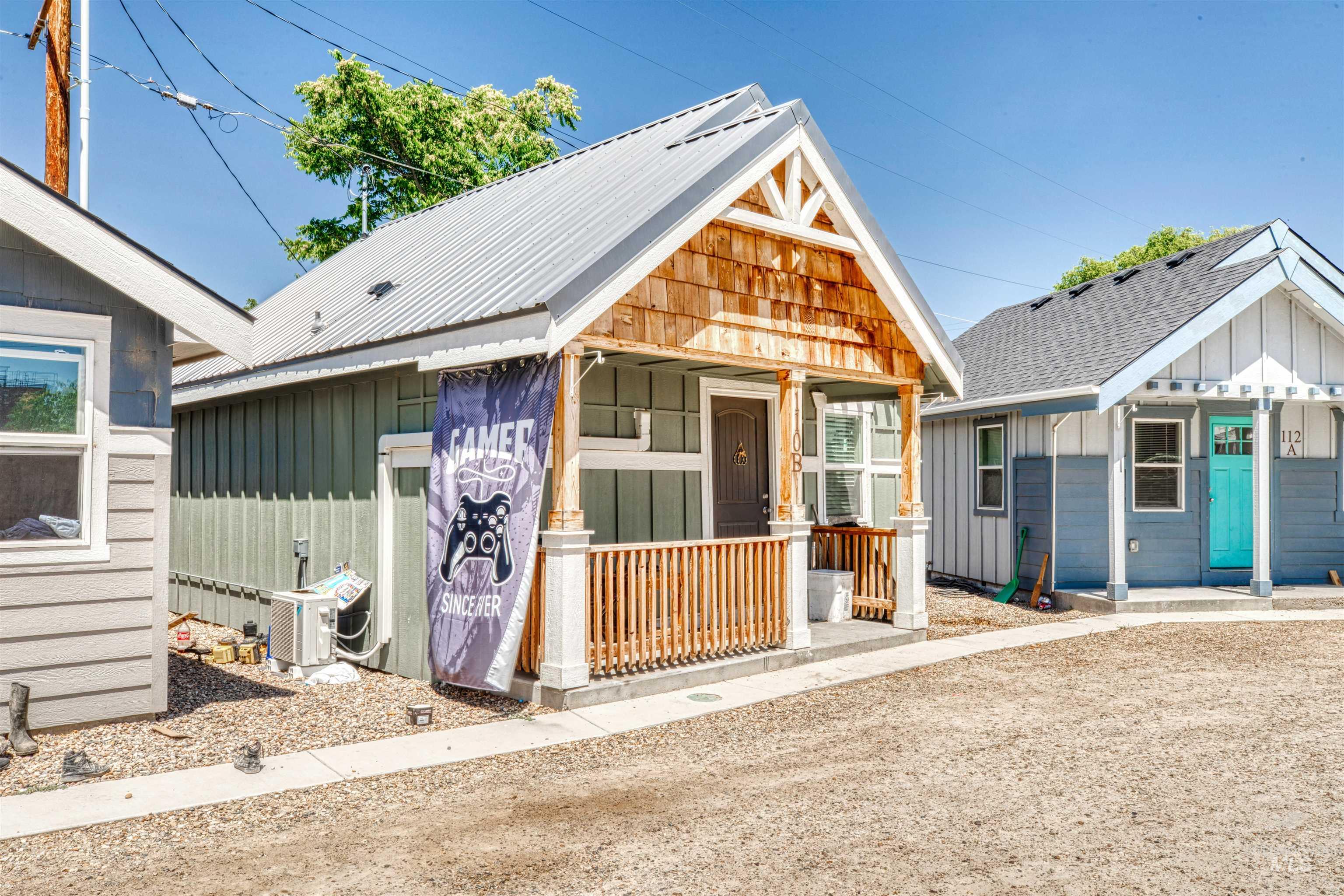 110 East Main Street Nyssa, OR 97913 - Photo 11 of 17 View of front of home with board and batten siding, covered porch, and a metal roof