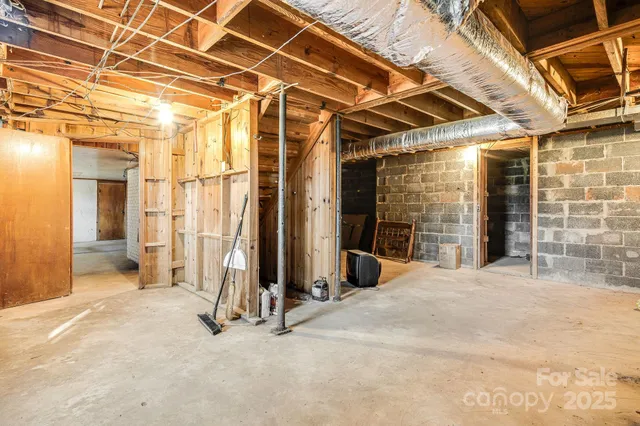 a bathroom with a tub a sink and a window