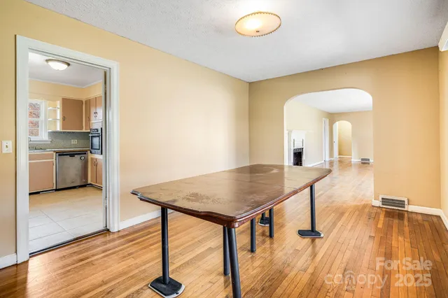 a view of a kitchen counter space and wooden floor