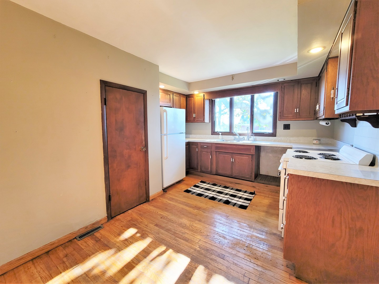 6932 Randall Road Poplar Grove, IL 61065 - Photo 11 of 44 a kitchen with stainless steel appliances a stove a sink and a refrigerator